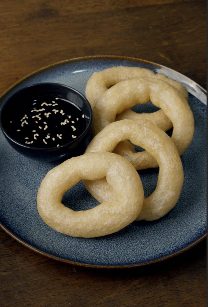 Mont lat kout glutinous rice rings with jaggery syrup